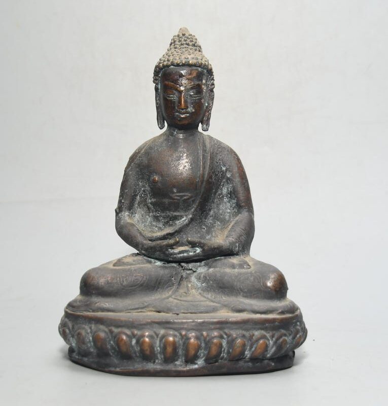 Antique bronze Buddha in dhyana mudra