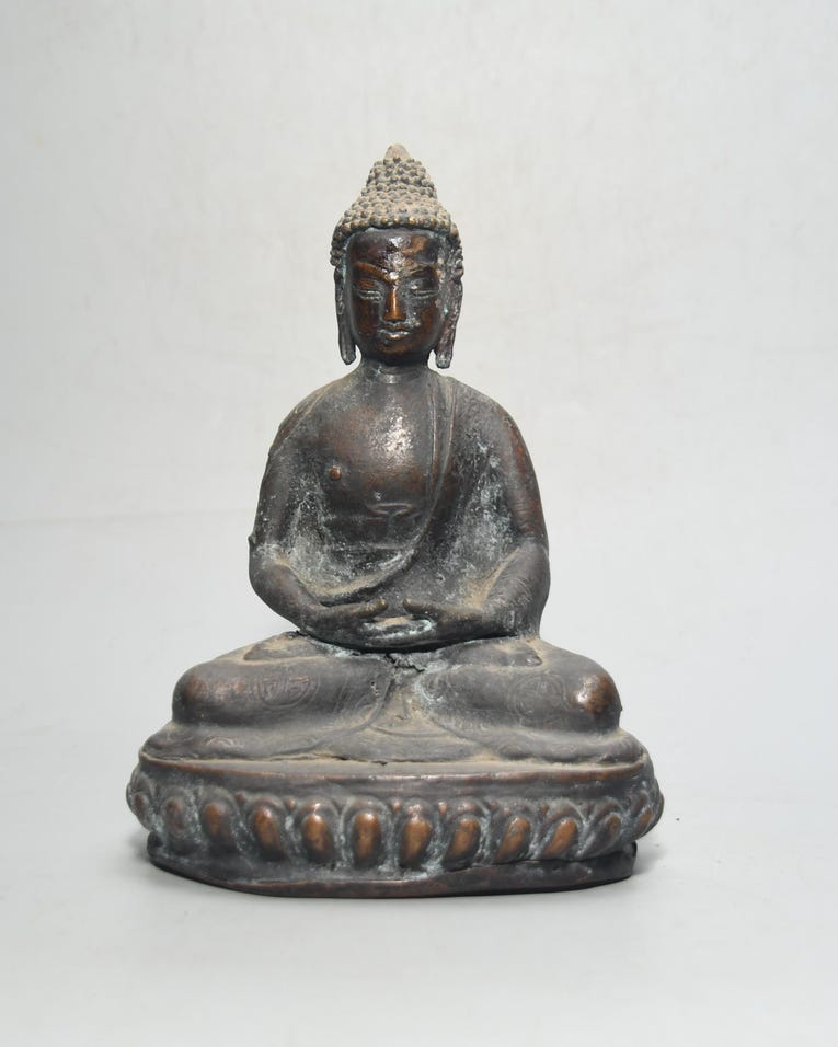 Antique bronze Buddha in dhyana mudra